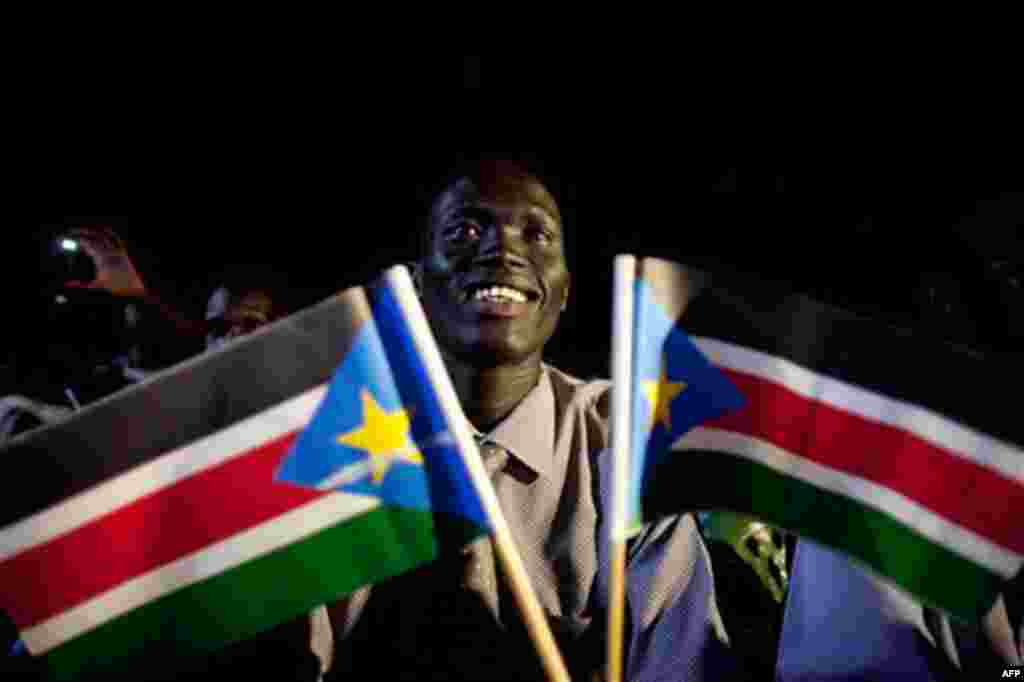 A southern Sudanese man watches a publicly televised broadcast of the formal announcement of referendum results in the southern capital of Juba. Southern Sudan will remain united with the north until the expiration of Comprehensive Peace Agreement in July