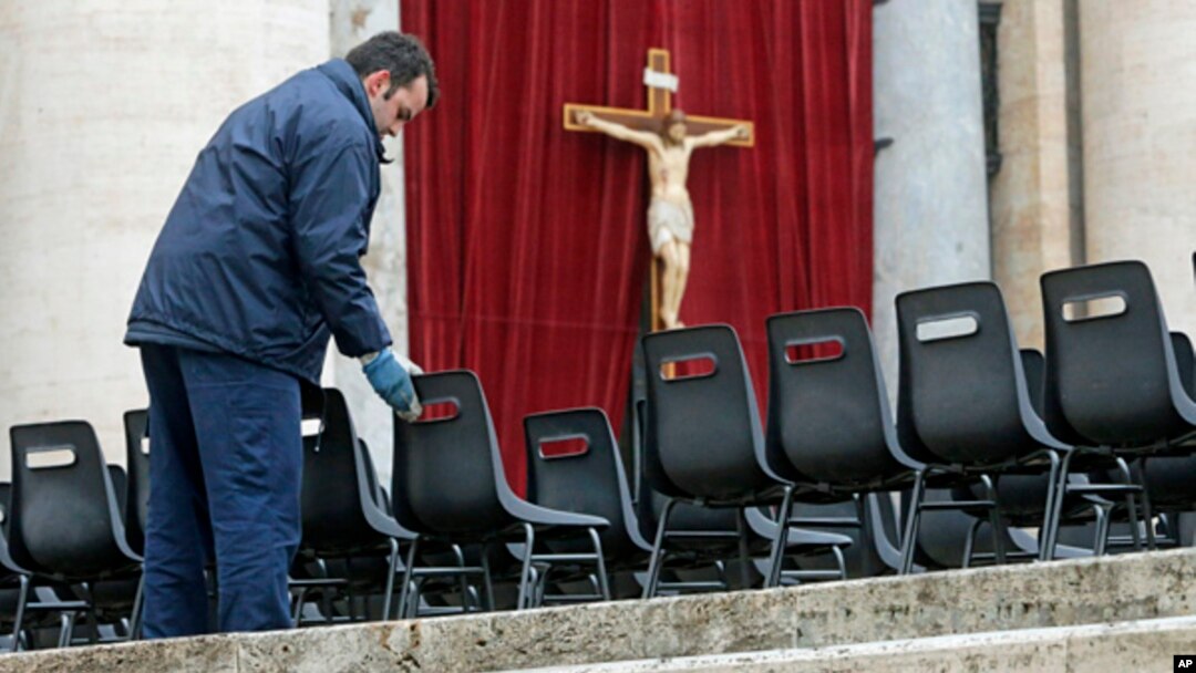 Workers install chairs in St. Peter's Square at the Vatican, March 18, 2013 for Pope Francis' Installation Mass on Tuesday. 