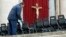 Workers install chairs in St. Peter's Square at the Vatican, March 18, 2013 for Pope Francis' Installation Mass on Tuesday. 