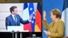 German Chancellor Angela Merkel waves to French President Emmanuel Macron at the end of a press conference following German-French Security Council video talks in Berlin, Germany, Feb. 5, 2021.