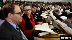 Louisa Hanoune, second left, Leader of Algeria's Workers' Party attends the constitutional reforms vote session in Algiers, Algeria, Feb. 7, 2016. 