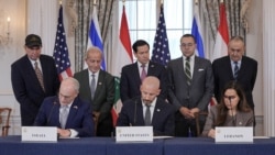 Ambassadors to the U.S. from Israel and Lebanon sign an agreement with State Department Counselor Daniel Holler, Washington, D.C.