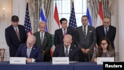 Ambassadors to the U.S. from Israel and Lebanon sign an agreement with State Department Counselor Daniel Holler, Washington, D.C.
