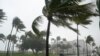 A normally bustling Ocean Drive is shown during a downpour, Sunday, Nov. 8, 2020, on Miami Beach, Florida's famed South Beach. A strengthening Tropical Storm Eta cut across Cuba on Sunday, and forecasters say it's likely to be a hurricane before…