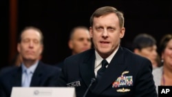 U.S. Cyber Commander Commander, National Security Agency Director Adm. Michael Rogers testifies on Capitol Hill in Washington, Feb. 9, 2015.