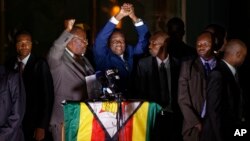 Zimbabwe's President in waiting Emmerson Mnangagwa, greets supporters gathered outside the Zanu-PF party headquarters in Harare, Zimbabwe, Nov. 22, 2017. 