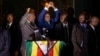 Zimbabwe's President in waiting Emmerson Mnangagwa, greets supporters gathered outside the Zanu-PF party headquarters in Harare, Zimbabwe, Nov. 22, 2017. 