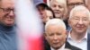 The leader of Poland's right-wing opposition party Law and Justice, Jaroslaw Kaczynski, front, attends the party's protest rally of a few thousand backers against the policies of Prime Minister Donald Tusk before the Ministry of Justice in Warsaw on Sept. 14, 2024.