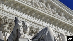 FILE - A detail of the west facade of the U.S. Supreme Court is seen in Washington, March 7, 2011.