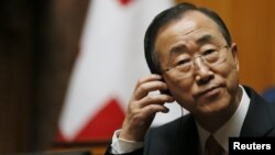 UN Secretary-General Ban Ki-moon listens to a speech in the Swiss National Council during his visit in the Autumn Parliament Session in Bern, September 11, 2012.