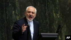 Iranian Foreign Minister Mohammad Javad Zarif, who is also Iran's top nuclear negotiator, addresses an open session of parliament in Tehran, July 21, 2015.