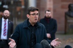 Greater Manchester mayor Andy Burnham speaks to the media outside Bridgewater Hall in Manchester, England, Oct. 20, 2020.