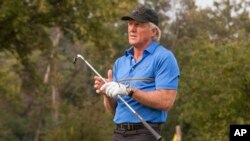 Golf Legend Greg Norman hosts an exclusive golf clinic for VIP guests at Oak Park Country Club in River Grove, Ill., Sept. 9, 2014.