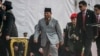 Indonesia's Minister of Defence and President-elect Prabowo Subianto arrives at a ceremony commemorating the Indonesian Police Day in Jakarta on July 1, 2024. He has undergone leg surgery but is continuing to work as he recovers, a spokesman said on July 2. 