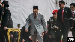 Indonesia's Minister of Defence and President-elect Prabowo Subianto arrives at a ceremony commemorating the Indonesian Police Day in Jakarta on July 1, 2024. He has undergone leg surgery but is continuing to work as he recovers, a spokesman said on July 2. 