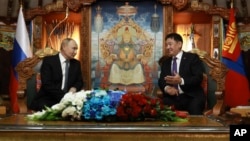 Russian President Vladimir Putin, left, and Mongolian President Ukhnaagiin Khurelsukh attend a meeting at the Saaral Ordon Government Building in Ulaanbaatar, Mongolia, Sept. 3, 2024.