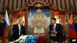 Russian President Vladimir Putin, left, and Mongolian President Ukhnaagiin Khurelsukh attend a meeting at the Saaral Ordon Government Building in Ulaanbaatar, Mongolia, Sept. 3, 2024.