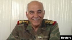 Former Syrian army commander, General Mustafa al-Sheikh, defected and wants to to lead rebel Free Syrian Army forces against Assad regime. (Reuters)