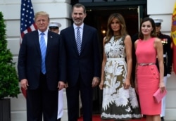 FILE - President Donald Trump, left, poses for a photo with Spain's King Felipe VI, second from left, first lady Melania Trump, third from right, and Queen Letizia, right, on the South Lawn of the White House in Washington, June 19, 2018.