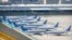 FILE - China Southern Airlines Boeing 737 Max airplanes are parked at the edge of the tarmac at Urumqi Diwopu Interational Airport in Urumqi, China, April 21, 2021. 