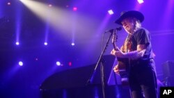 FILE - Willie Nelson performs at the iTunes Festival during the SXSW Music Festival in Austin, March 15, 2014.