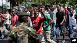 Demonstrators in Bujumbura protesting President Nkurunziza's decision to seek a third term in office (AP Photo/Jerome Delay)