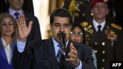 FILE - Venezuelan President Nicolas Maduro speaks at Miraflores Presidential Palace in Caracas, June 21, 2019. The U.S. Treasury Department on June 27, 2019, indicted two former officials in Maduro's government on money laundering and corruption charges.