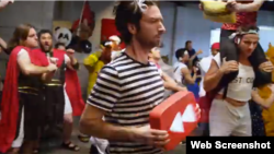 People are seen dancing the Harlem Shuffle in a still from YouTube's year-end video. The dance went viral in 2013.