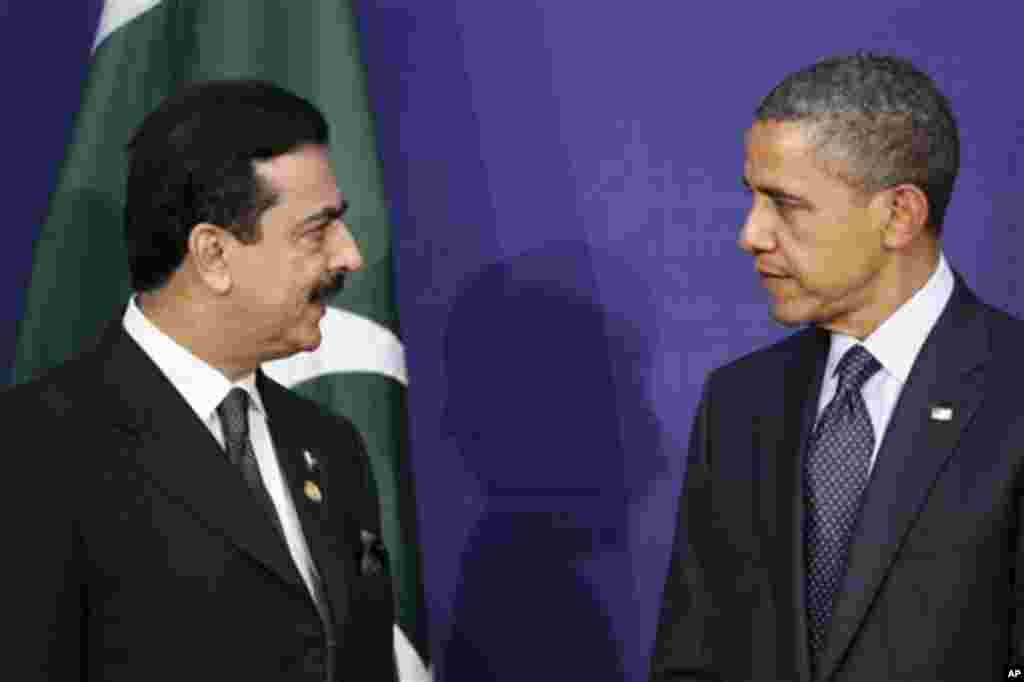 Pakistani Prime Minister Syed Yusuf Raza Gilani, left, speaks to U.S. President Barack Obama during their bilateral meeting on the sidelines of the Nuclear Security Summit in Seoul, South Korea, Tuesday, March 27, 2012. (AP Photo/Pablo Martinez Monsivais)