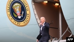 US President Joe Biden disembarks Air Force One at Boston Logan International Airport in Boston, Massachusetts, on December 5, 2023.