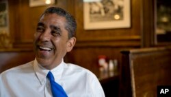 FILE - Adriano Espaillat smiles during an interview in New York, July 6, 2016.