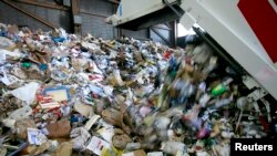 Refuse is unloaded at Recology in San Francisco, Calif., Nov. 2, 2009. Since Jan. 1, when China banned imports of some recyclables, much of what the U.S. recycles has no place to go.