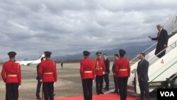 US Secretary of State John Kerry steps off his plane upon his arrival in Tirana, Albania, Feb. 14, 2016. (Pam Dockins/VOA)