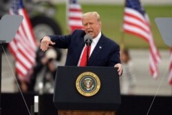 FILE - President Donald Trump speaks during a campaign rally at MBS International Airport in Freeland, Mich., Sept. 10, 2020.