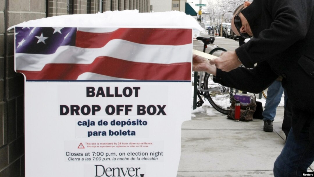 A voter participates in early balloting outside the Denver Elections Division in downtown Denver, Colorado on October 25, 2012. 
