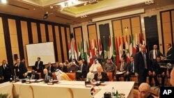 Members of the Arab League hold a meeting on Syria in Cairo, Egypt, January 8, 2012.