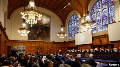 FILE - Delegates attend the U.N.'s International Court of Justice public hearings in an advisory opinion case that may become a reference point in defining countries' legal obligations to fight climate change, in The Hague, Netherlands, Dec. 2 2024. 