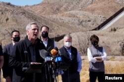 FILE - House Minority Leader Kevin McCarthy speaks to the press during a tour for a delegation of Republican lawmakers of the US-Mexico border, in El Paso, Texas, March 15, 2021.