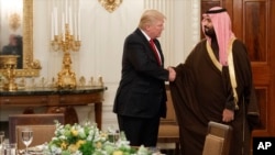 President Donald Trump shakes hands with Saudi Defense Minister and Deputy Crown Prince Mohammed bin Salman, in the State Dining Room of the White House in Washington, March 14, 2017.