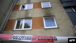 Police cordon is seen in front of an apartment building in Essen, western Germany, on Sept. 29, 2024, the day after a fire broke out at the building. 