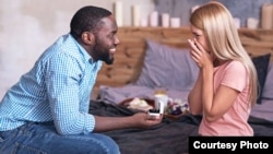 A couple gets engaged in an ad for State Farm insurance company. (Courtesy State Farm)