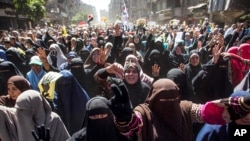 Supporters of the ousted Egypt's ousted President Mohamed Morsi march in Cairo, March 28, 2014. 