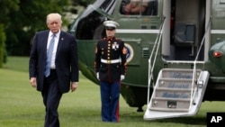 President Donald Trump arrives on Marine One on the South Lawn of the White House in Washington as he returns from speaking in Lynchburg, Va., at the Liberty University commencement ceremony, May 13, 2017. 