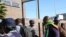 FILE: UMfundisi Evan Mawarire phandle kwe Harare Central Police station in Zimbabwe, July 12, 2016. 