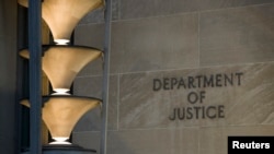 The Department of Justice is seen, March 22, 2019, in Washington. 