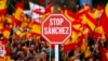 Demonstrators hold banners and Spanish flags during a protest in Madrid, Spain, Feb.10, 2019. 