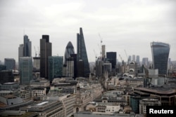 FILE - A view of the London skyline shows the City of London financial district, seen from St Paul's Cathedral in London, Feb. 25, 2017.