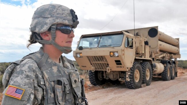 A U.S. soldier guards a part of the THAAD missle system.