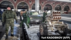 RUSSIA -- Russian officers stand near the train with "Syrian turning point" exhibition organized by Russian Defence Ministry on a open goods truck at Kazansky railway station in Moscow on February 23, 2019