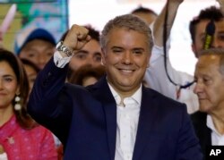 FILE - Colombia's President-Elect Ivan Duque celebrates his victory in the presidential runoff election, in Bogota, Colombia, June 17, 2018.